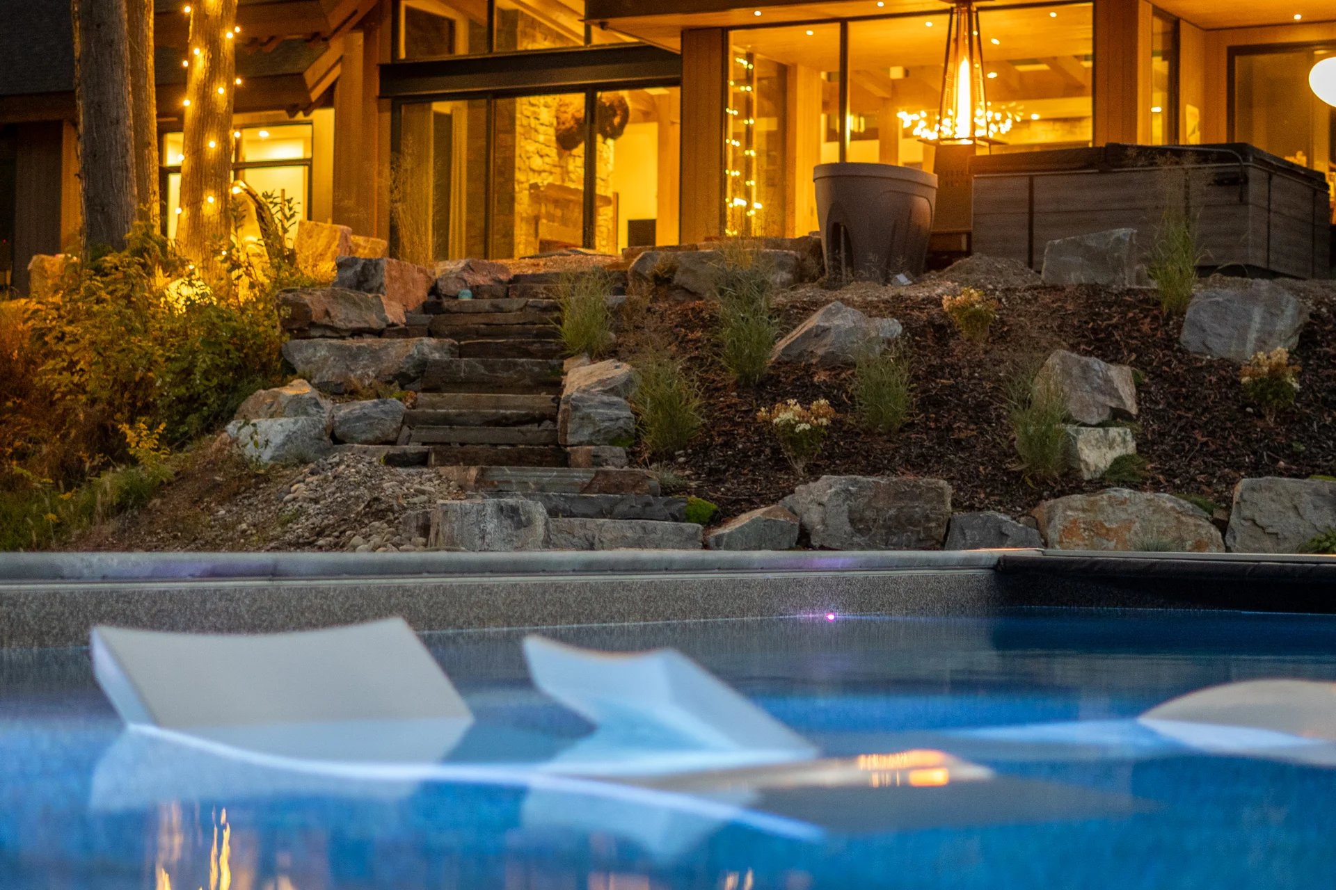 In-pool loungers on the tanning ledge, looking across Williamson Lake to Mount MacKenzie