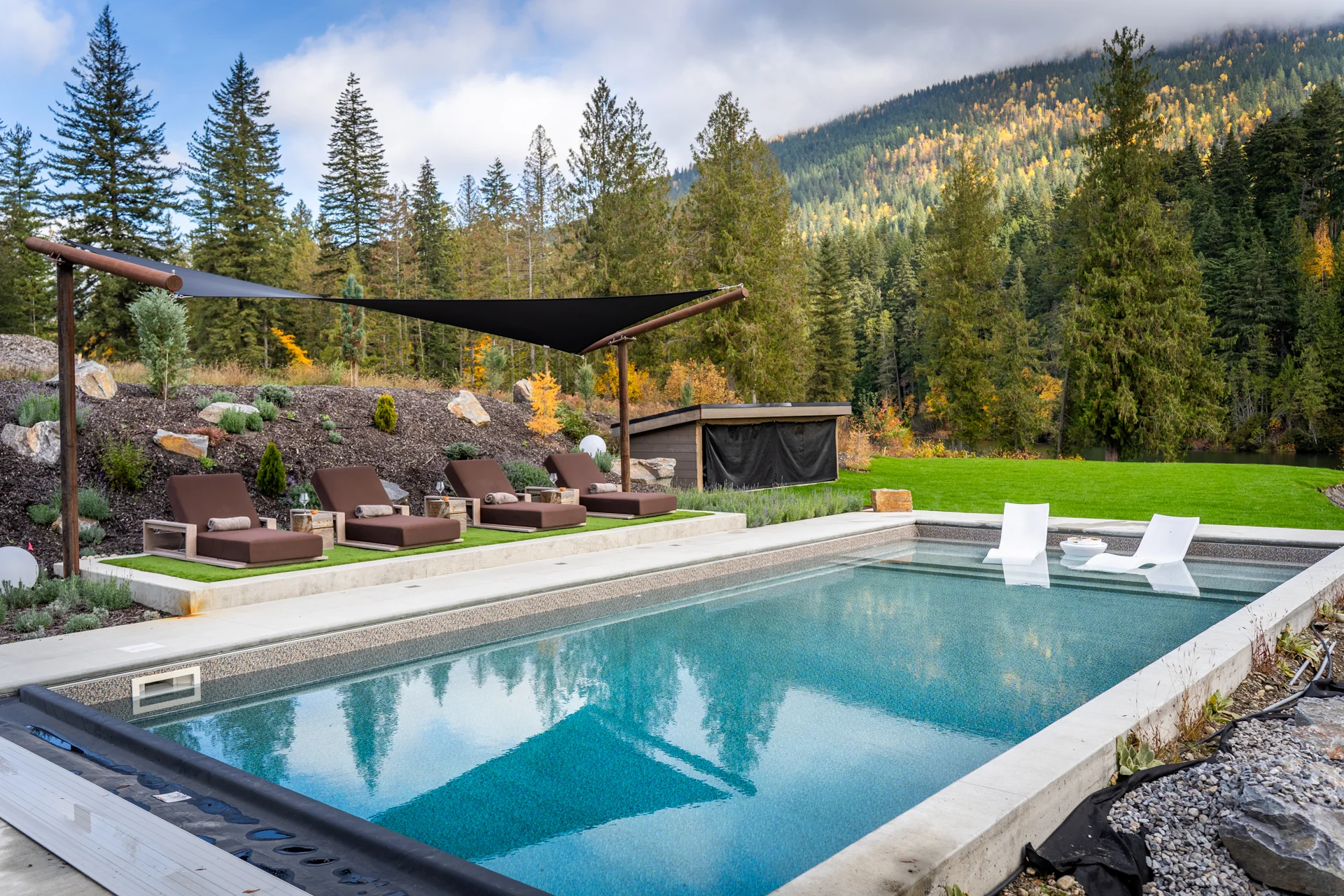 Master suite with floor to ceiling windows and access to outdoor patio.