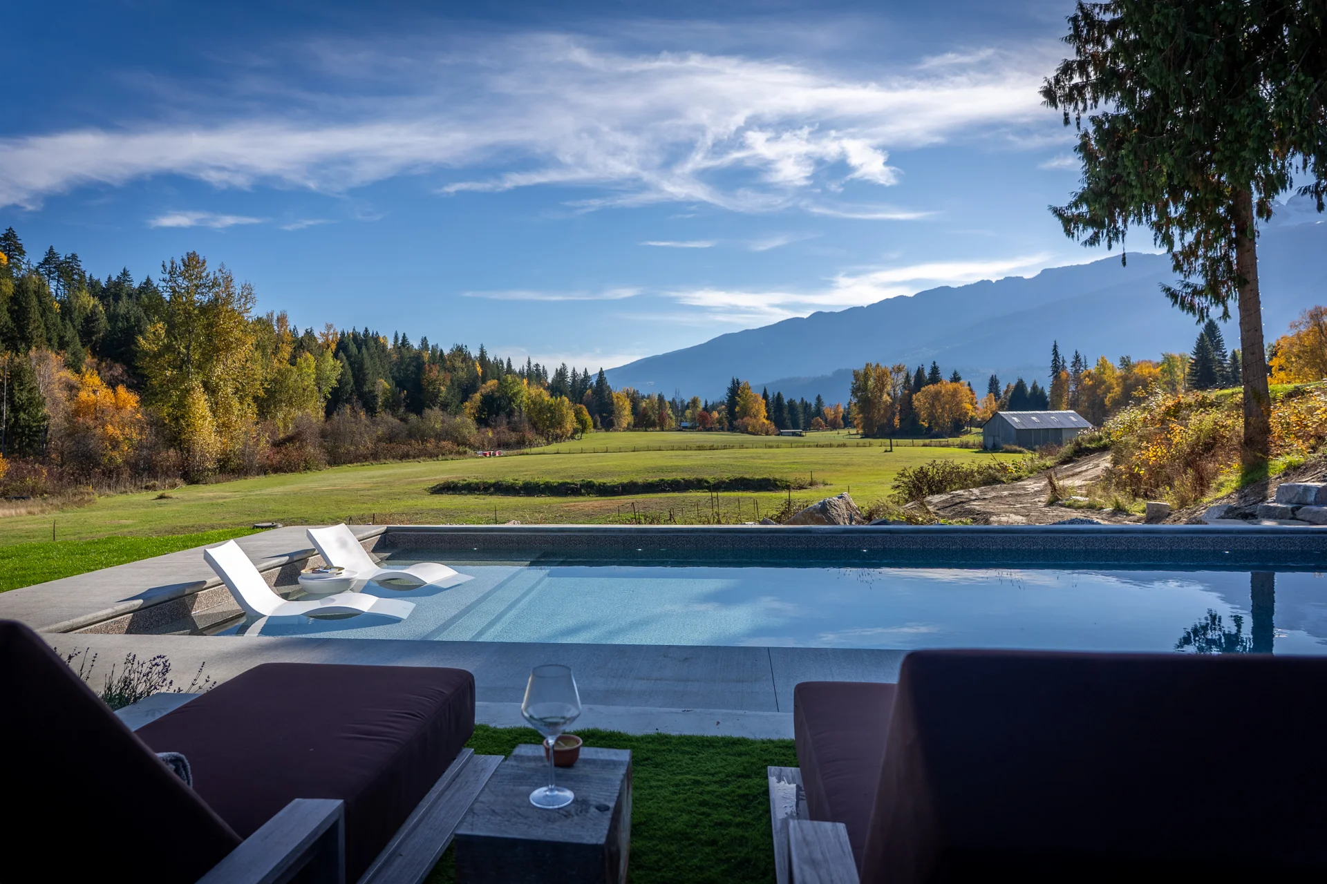 The pool and tanning ledge with mountain views